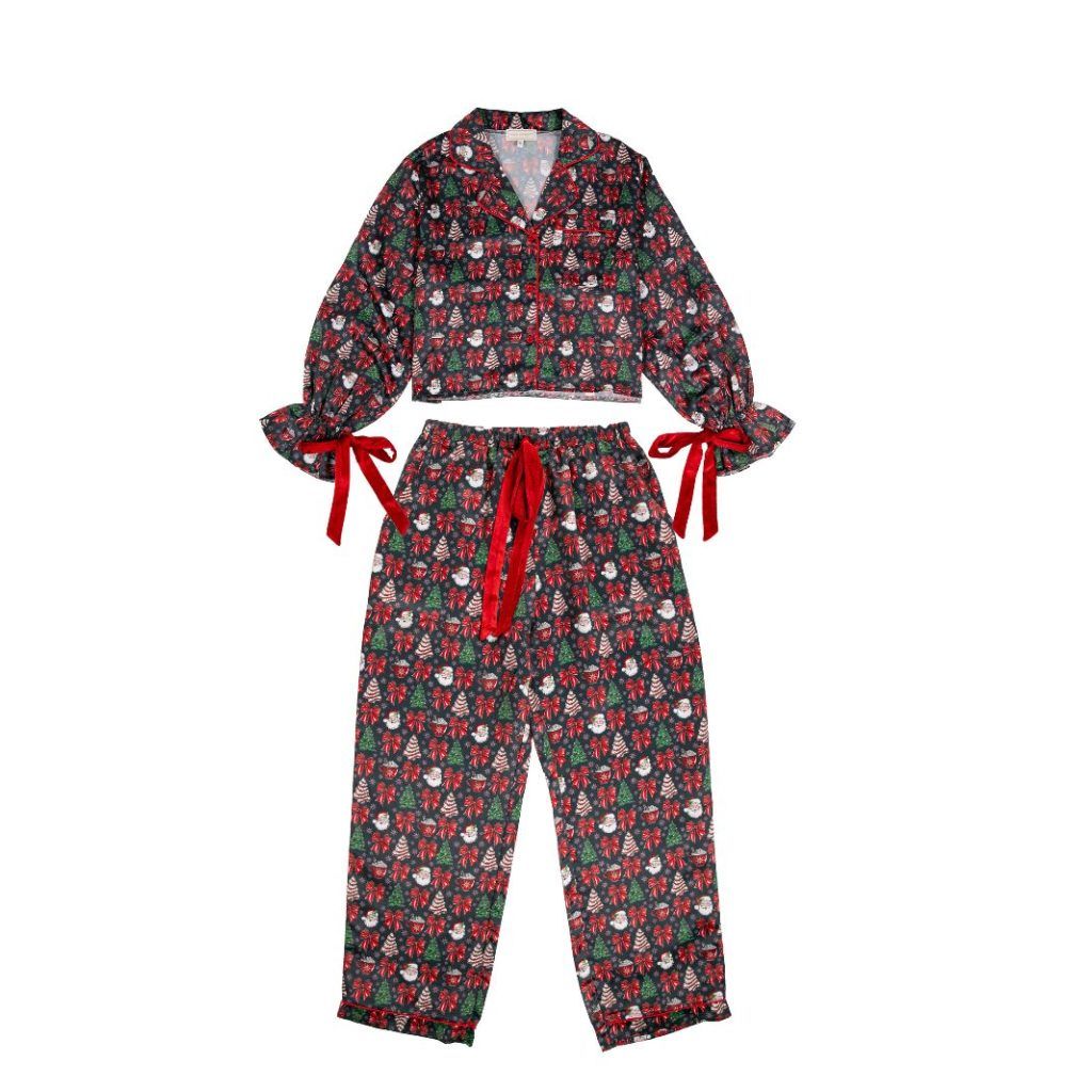 Women’s black Christmas themed two-piece long sleeve and pants pajama set, Christmas tree, bow, and Christmas tree cake graphics