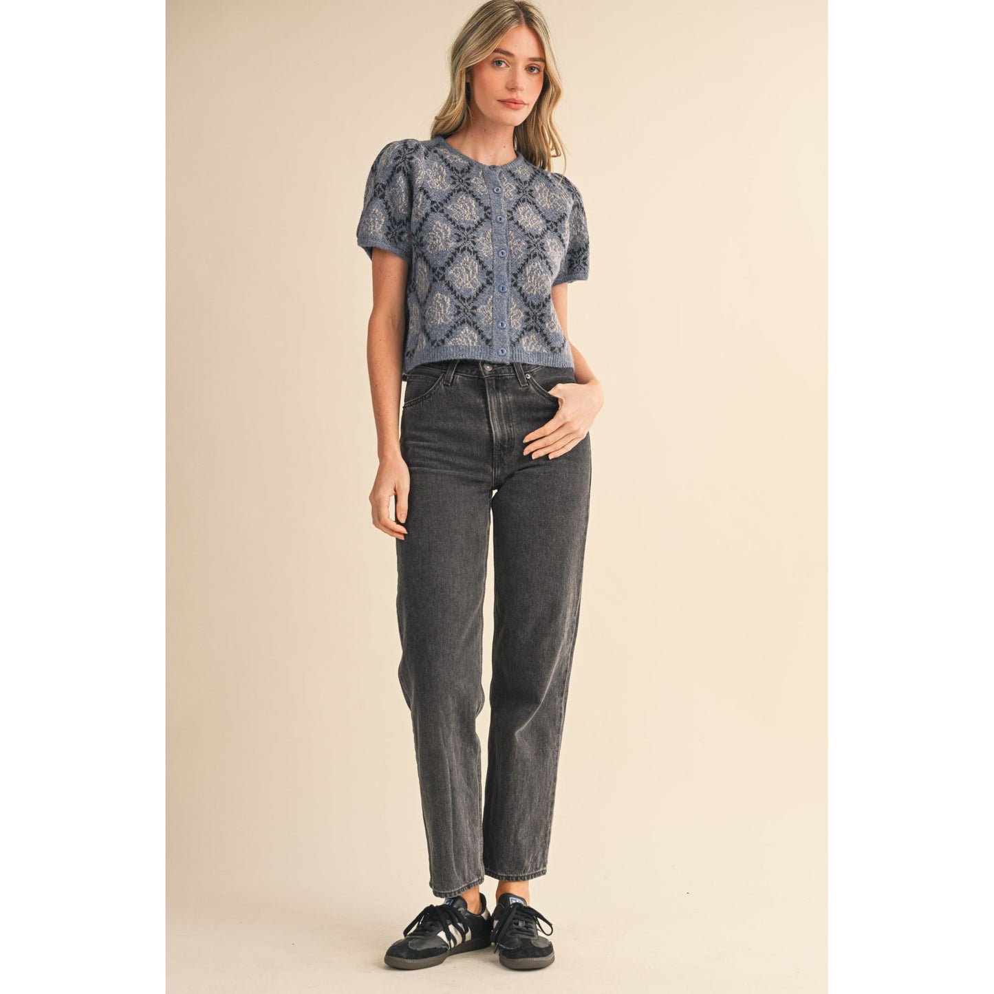 Woman wearing short-sleeved floral knit cardigan