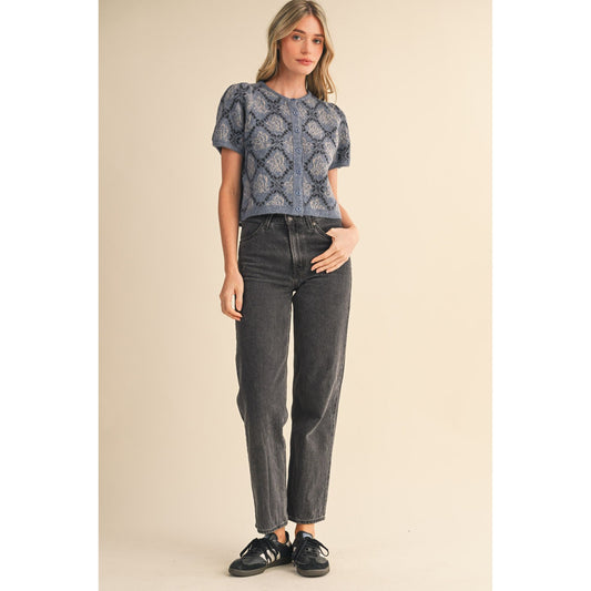 Woman wearing short-sleeved floral knit cardigan