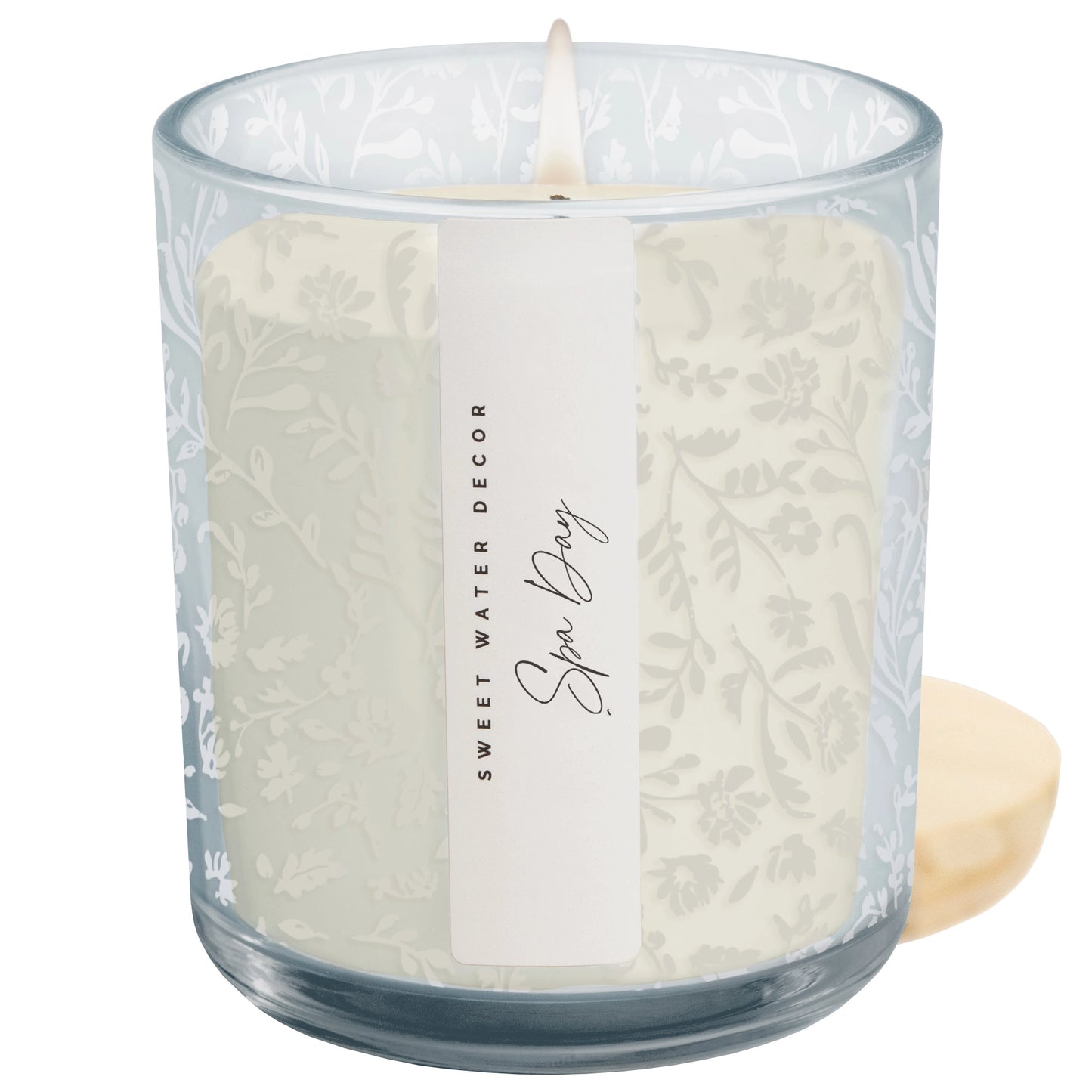 Candle in a glass jar with a label on a white background