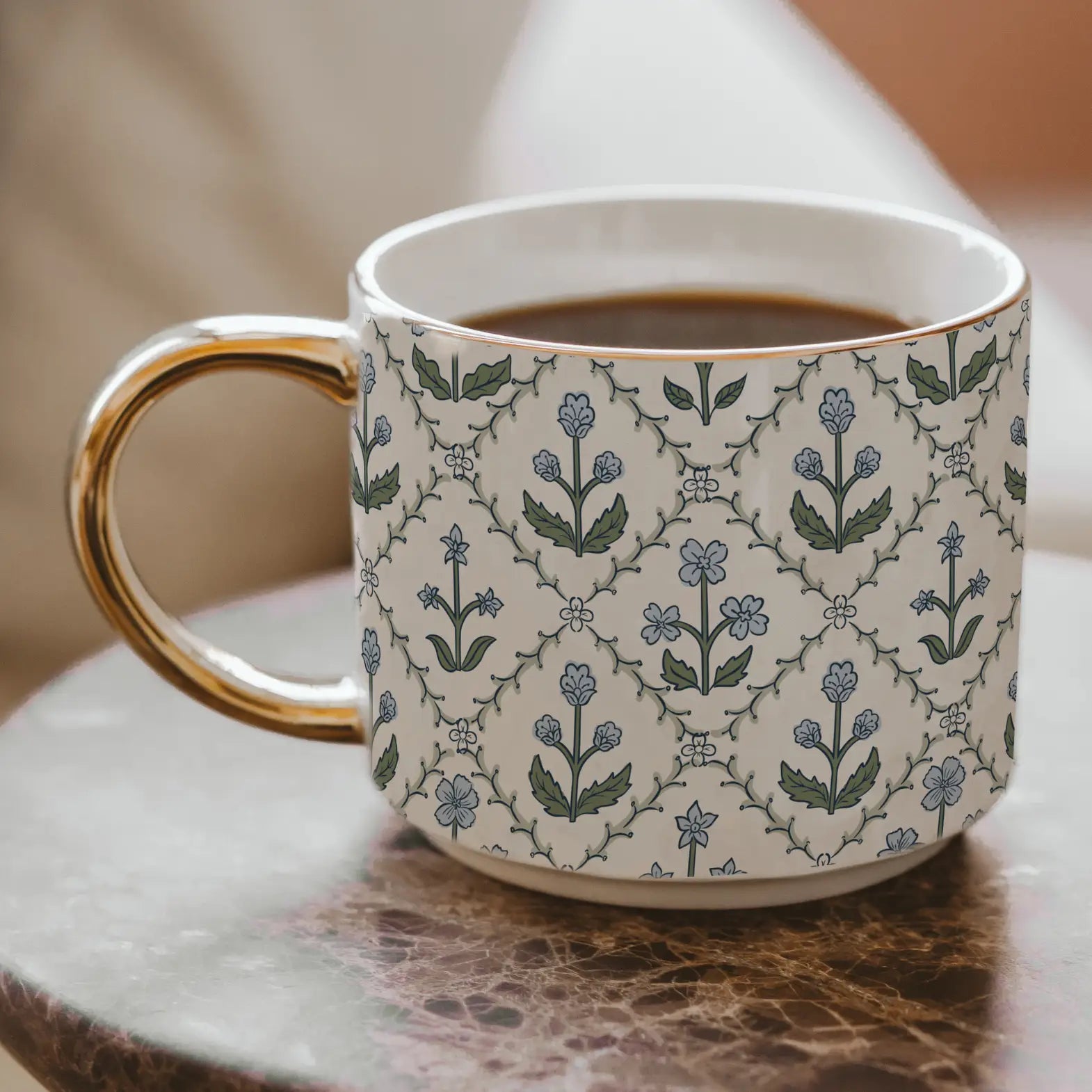Patterned mug with a floral design on a wooden surface