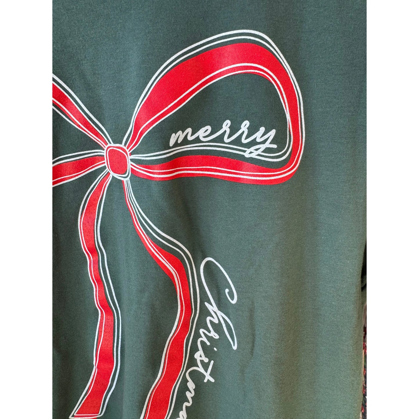 Green fabric with a red bow and 'merry Christmas' text design
