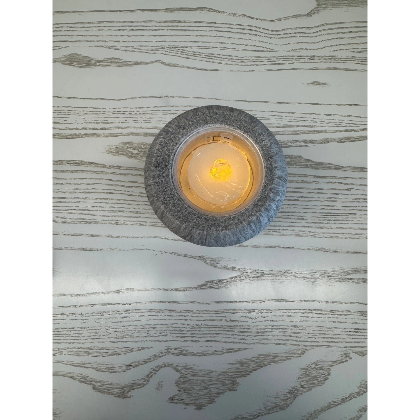 Top view of grey stone lighted water fountain