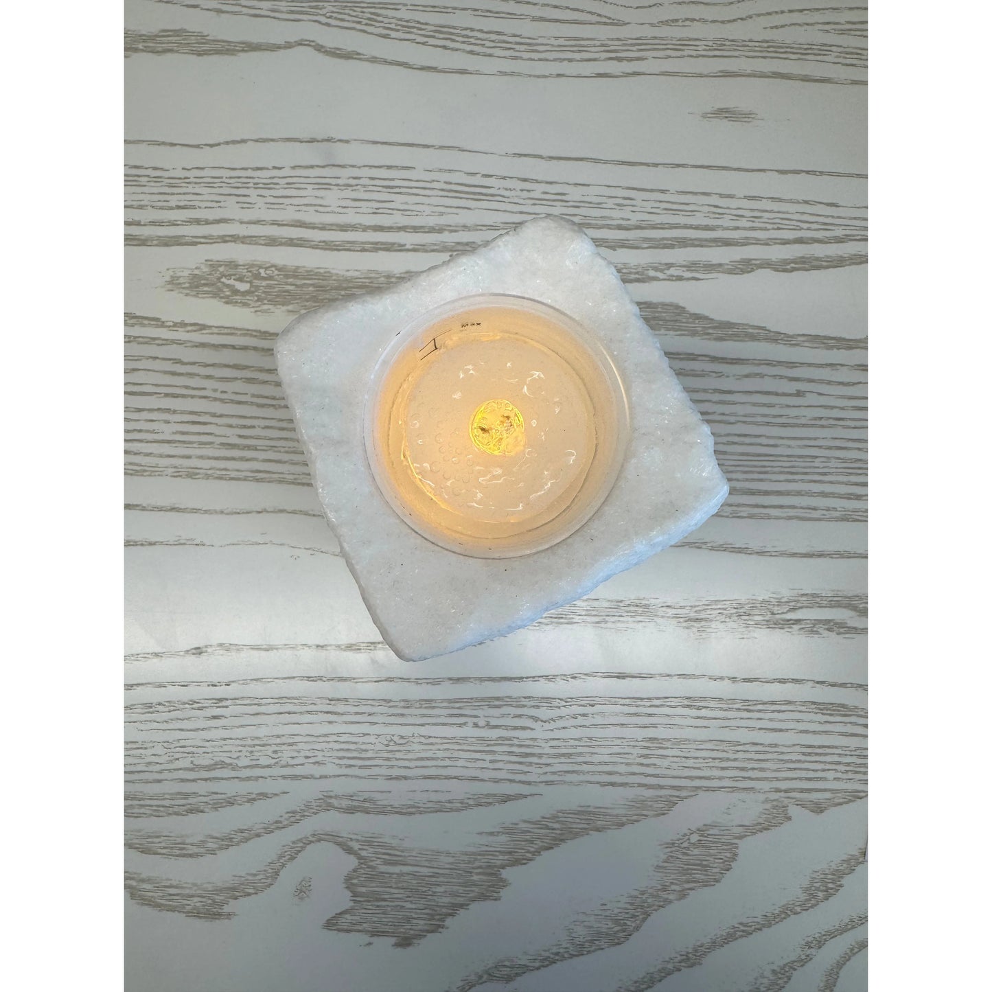 Top view of a white lighted, water fountain