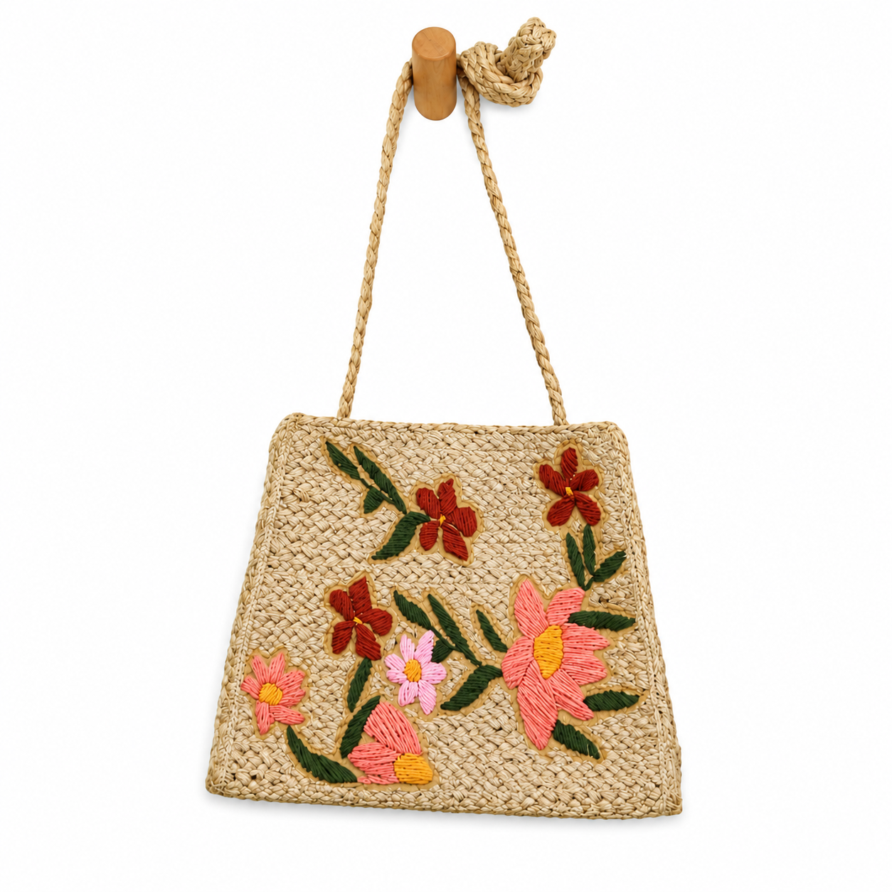 Woven handbag with floral embroidery on a white background