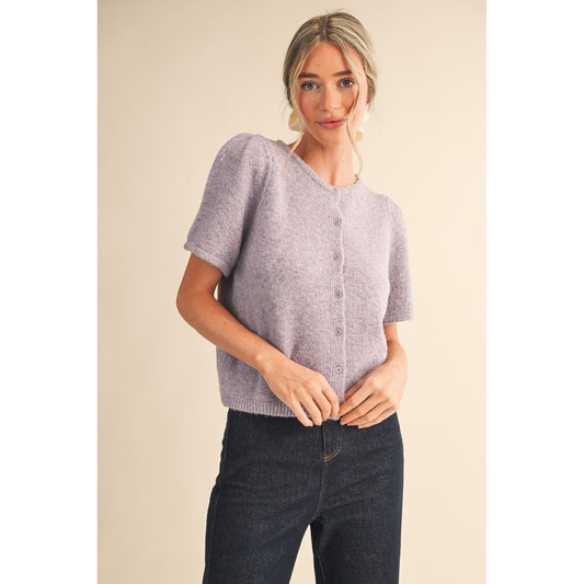 Woman wearing a light purple short-sleeve cardigan 