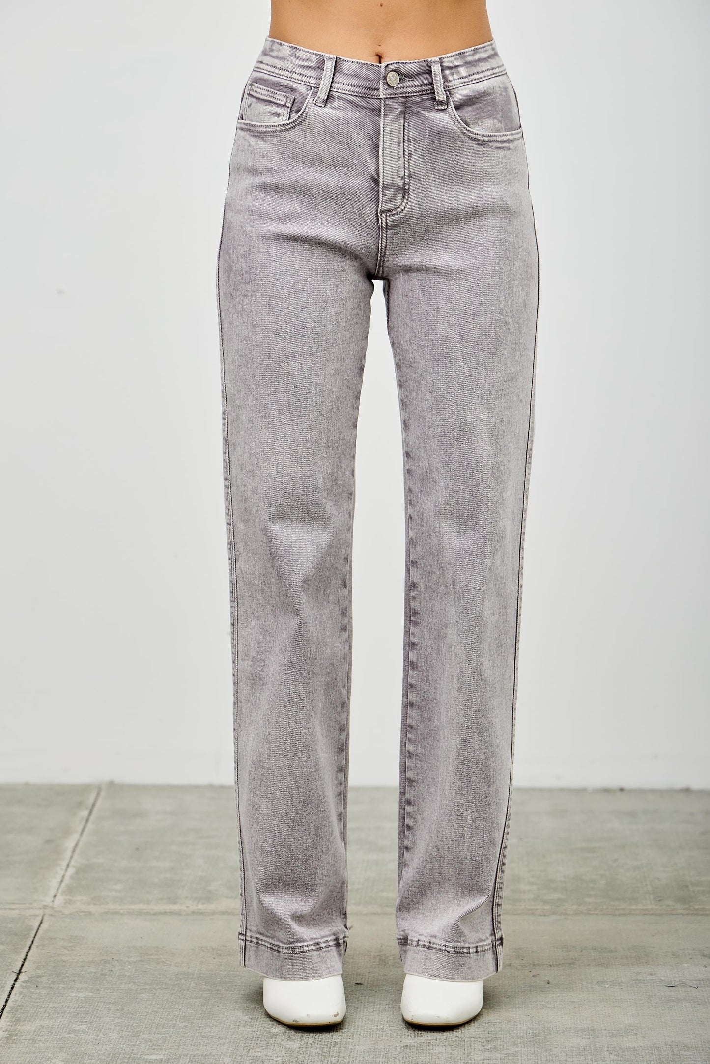 Gray jeans on a women with a white background