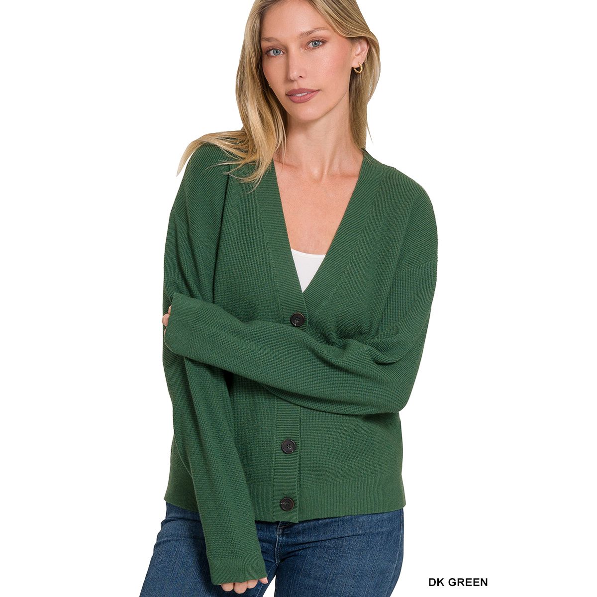 Woman wearing a green cardigan on a white background
