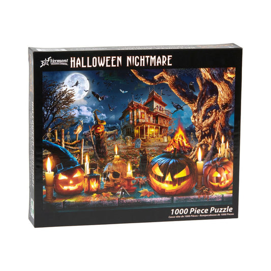 Halloween-themed puzzle box with pumpkins, candles, and a haunted house on a dark background.