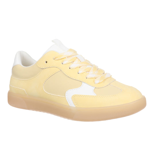 Yellow sneaker with white laces on a white background